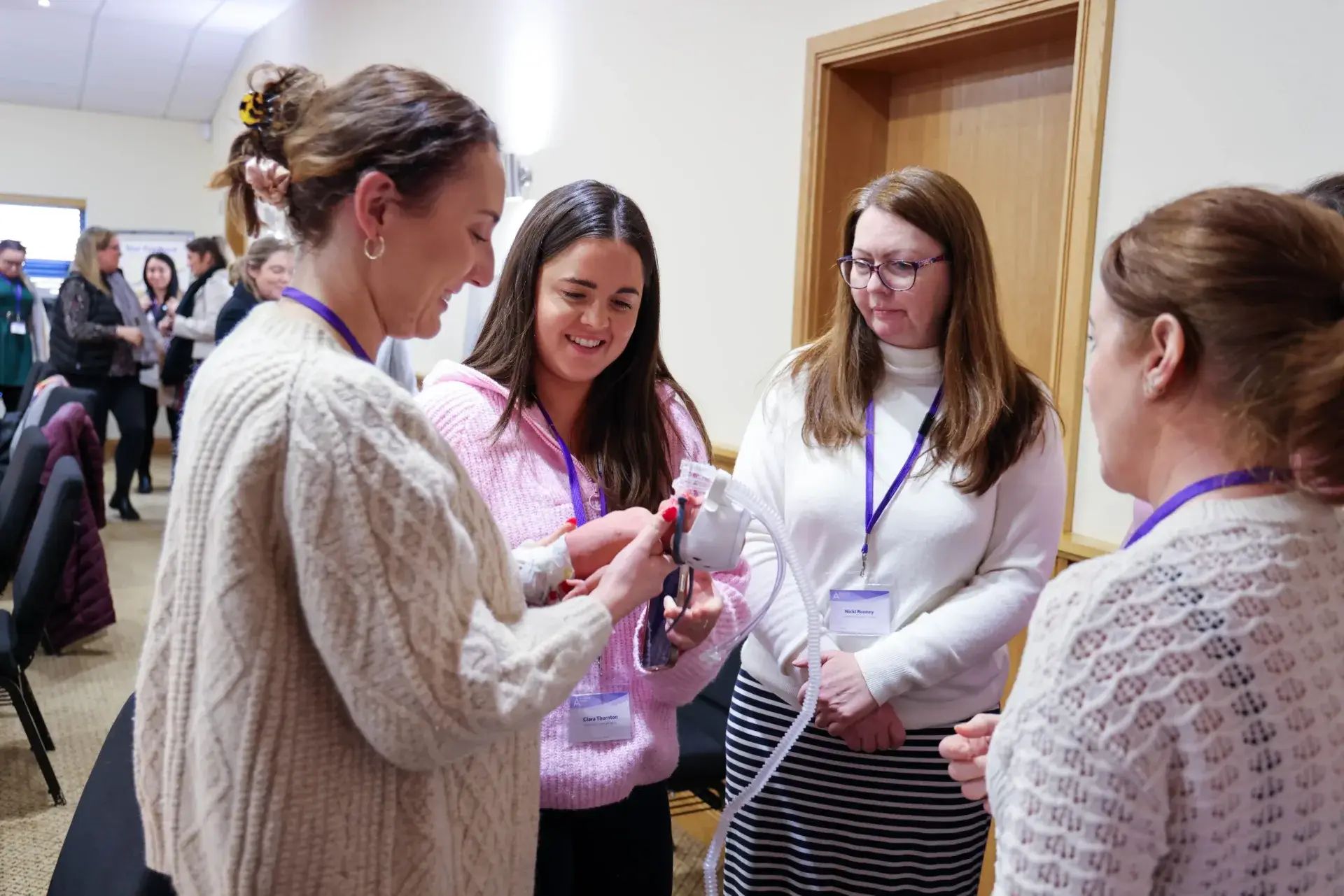 Team of neonatal nurses looking at a neonatal care product